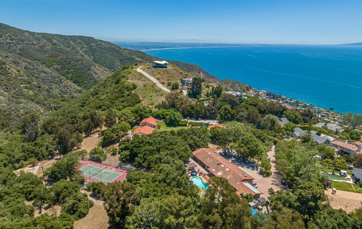 The 3-acre property includes three homes, two swimming pools and a tennis court overlooking the ocean.