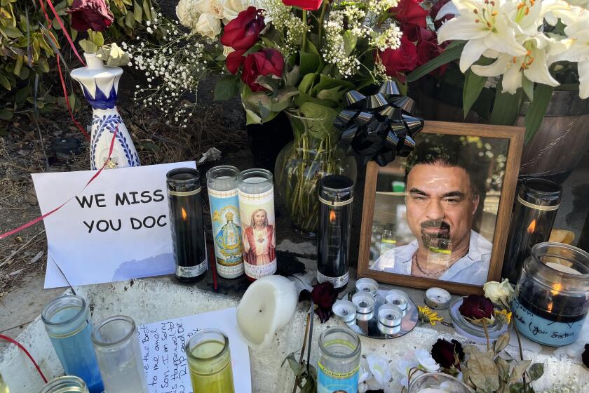 Woodland Hills, California-Aug. 27, 2024-A memorial has formed for Dr. Hamid Mirshojae, who was shot and killed outside his medical center, Warner Plaza Medical Clinic, in Woodland Hills, on Friday, Aug. 23, 2024. (Noah Goldberg/Los Angeles Times)