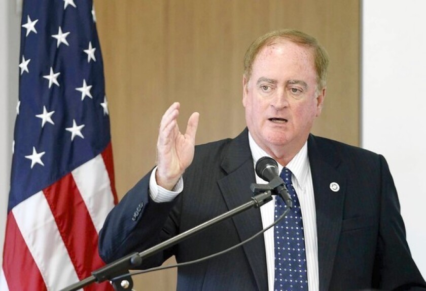Newport Beach City Councilman Keith Curry speaks during an immigration panel at Concordia University on Friday. He also serves as director of the school's Center for Public Policy.
