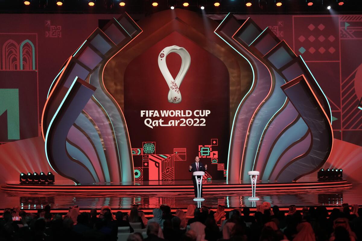 FILE - FIFA President Gianni Infantino speaks before the 2022 soccer World Cup draw at the Doha Exhibition and Convention Center in Doha, Qatar, on April 1, 2022. This season will be unique in the 135-year history of domestic leagues in Europe. They will stop for a month or more while players leave for Qatar and the first World Cup ever in the European winter. (AP Photo/Hassan Ammar, File)