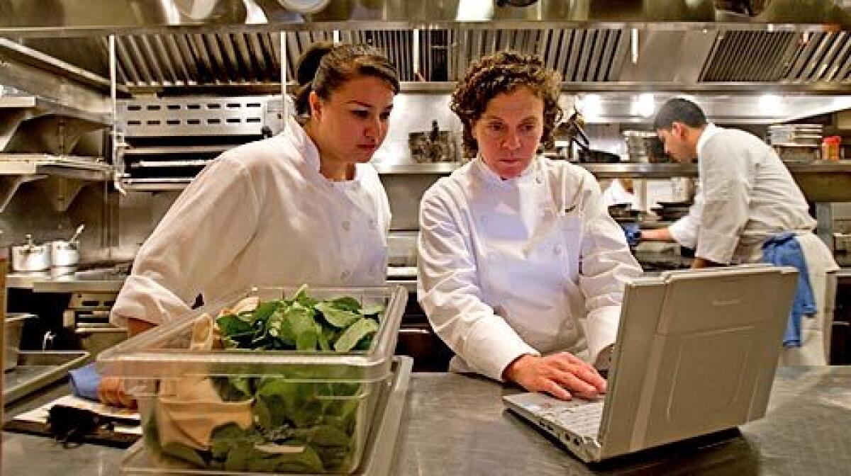 CLICK: Traci des Jardins, right, gets online with one of her chefs, Anastacia Quinones, at Jardiniere in San Francisco.