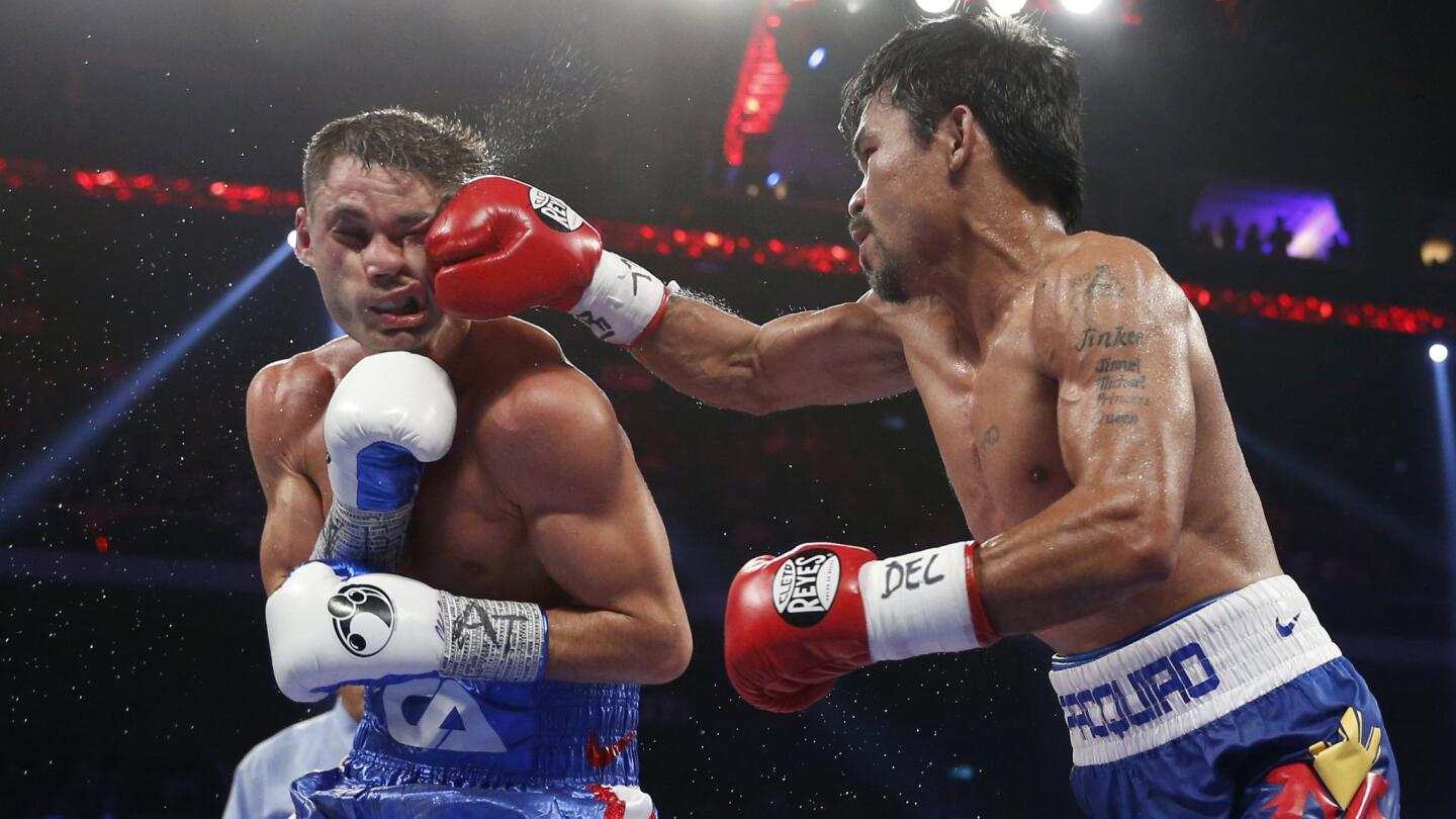 Manny Pacquiao, right, of the Philippines lands a right to the face of Chris Algieri during their welterweight title fight at The Venetian in Macao on Nov. 23.