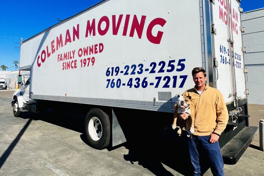 Matt Coleman, vice president of Coleman Moving Systems, Inc. (with Betty the bulldog), 