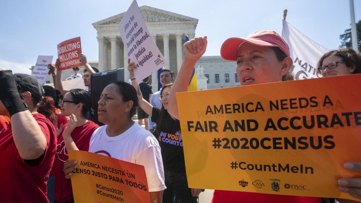 Demonstrators gather at the Supreme Court ahead of a decision on adding a citizenship question to the 2020 census on June 27.