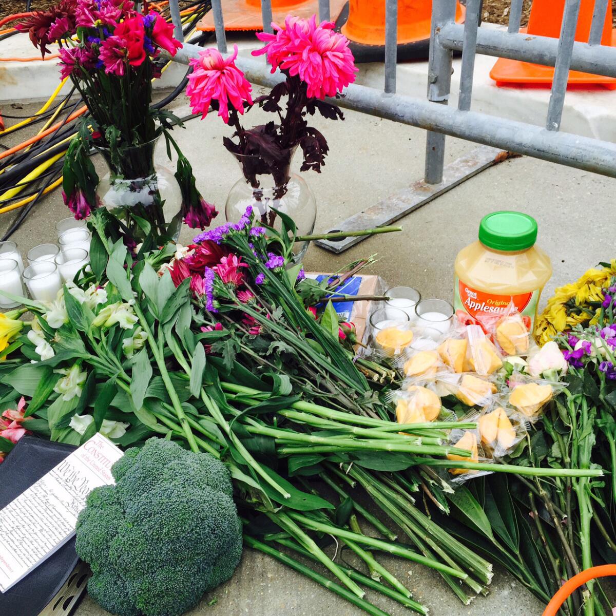 A small memorial outside the Supreme Court includes jars of applesauce, a package of paper bags and a pile of fortune cookies--a nod to the colorful language he used in biting dissents.