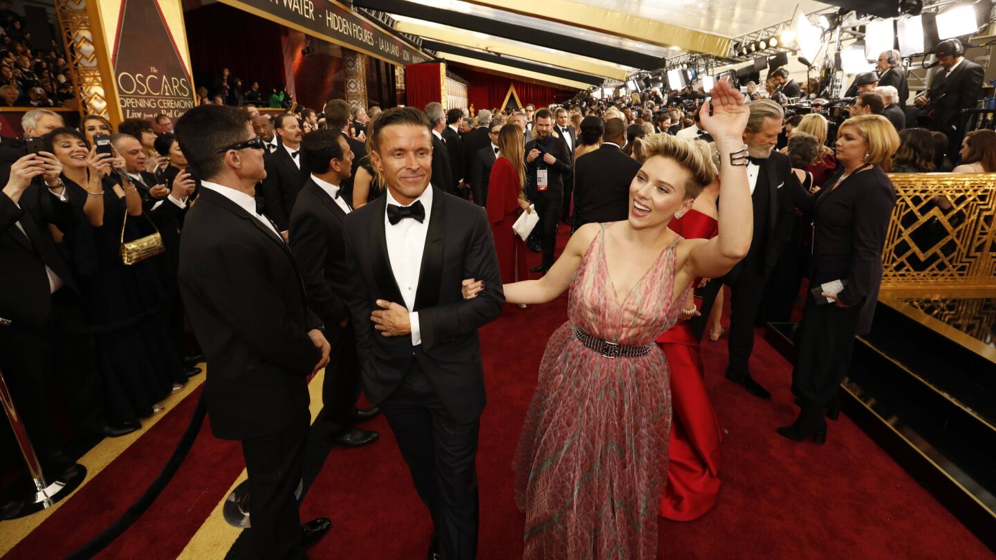 Scarlett Johansson and date Joe Machota of CAA arrive at the 89th Academy Awards.