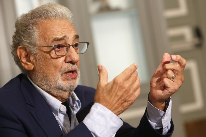 Spanish tenor Placido Domingo gestures as he answer a question during an interview with the Associated Press in Naples, Sunday, Aug. 23, 2020. Opera legend Placido Domingo denied ever abusing his power during his management tenure at two U.S. opera houses, as he embarks on a full-throttle campaign to clear his name after two investigations found credible accusations he had engaged with ‘’inappropriate conduct’’ with multiple women over a period of decades. (AP Photo/Riccardo De Luca)