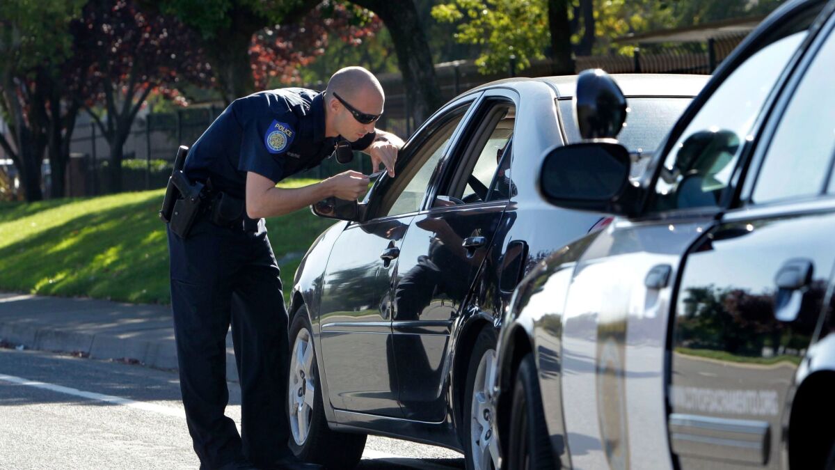 A police officer makes a traffic stop in Sacramento, Calif. 