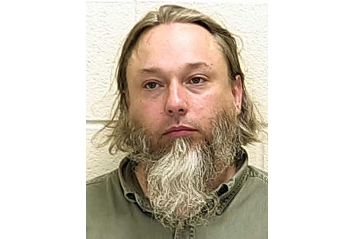 FILE - This undated file photo provided by The Ford County Sheriff's Office in Paxton, Ill., shows Michael Hari, a militia leader convicted of masterminding the bombing of a Minnesota mosque, Hari is now known by her transgender identity, Emily Claire Hari. Hari, the leader of an Illinois anti-government militia group who authorities say masterminded the 2017 bombing of a Minnesota mosque is to be sentenced Monday, Sept. 13, 2021. Emily Claire Hari, who was previously known as Michael Hari and recently said she is transgender, faces a mandatory minimum of 30 years in prison for the attack on Dar al-Farooq Islamic Center. (Ford County Sheriff's Office via AP File)