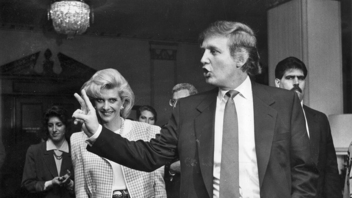 Donald Trump leaves a news conference with wife Ivana on Jan. 13, 1990, after announcing that he had purchased an interest in the Ambassador Hotel in Los Angeles. (Mindy Schauer / For The Times)