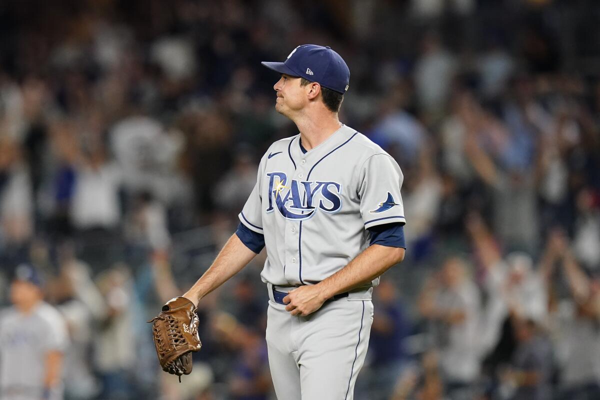 Tampa Bay Rays relief pitcher Brooks Raley watches a ball hit by New York Yankees' Josh Donaldson for a home run during the eighth inning of a baseball game Wednesday, Aug. 17, 2022, in New York. (AP Photo/Frank Franklin II)