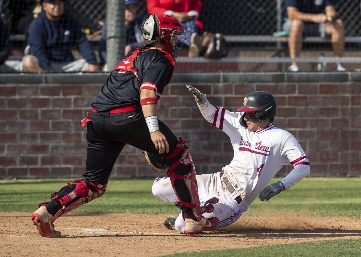 Ocean View's Quentin Custodio beats the throw to the plate in the third inning against Segerstrom on Thursday.
