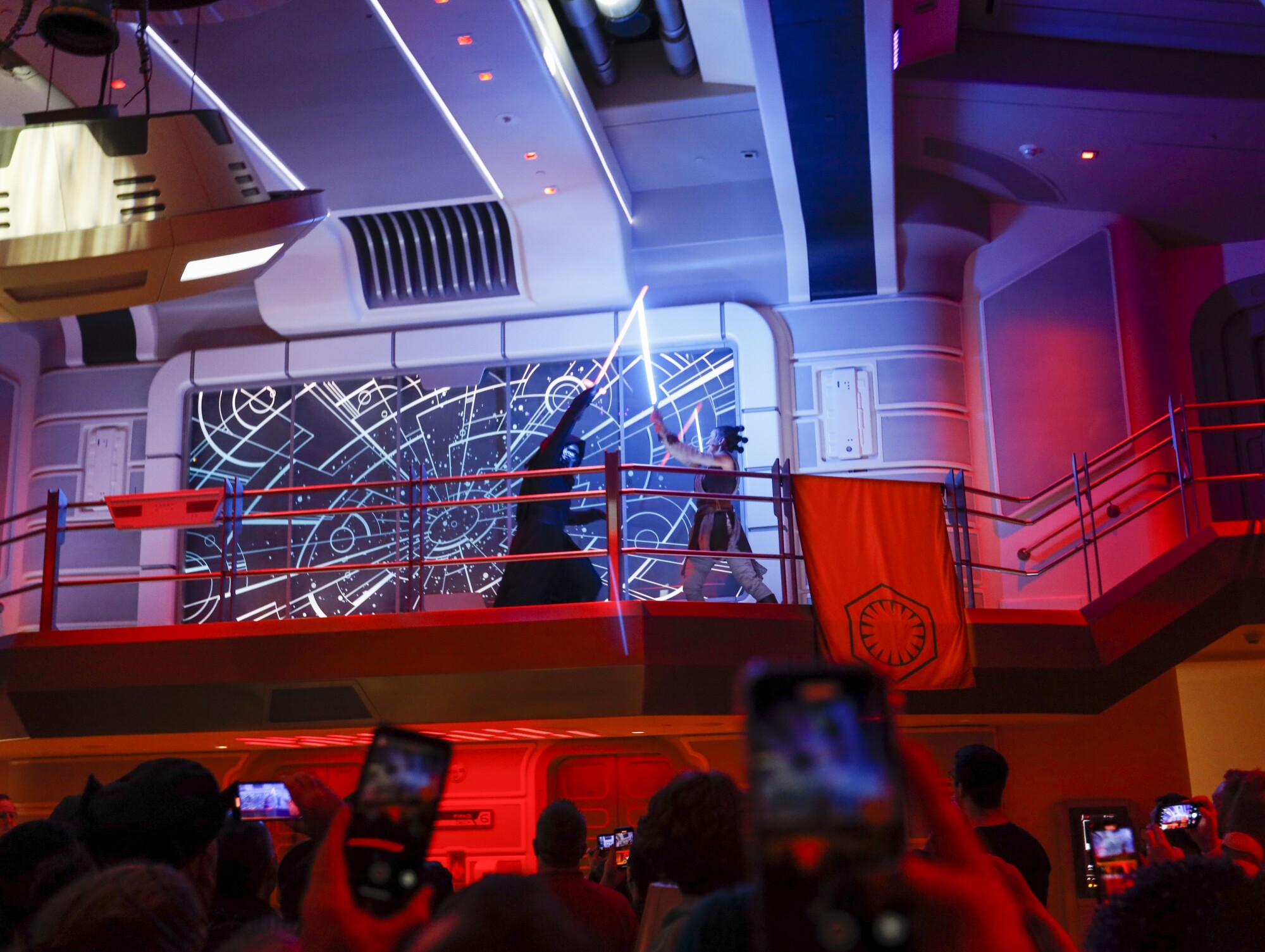 Kylo Ren, the Supreme Leader of the First Order, has a light saber battle with Rey, force-wielding hero of the Resistance.