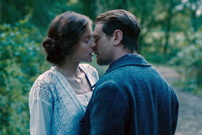 This image released by Netflix shows Emma Corrin, left, and Jack O'Connell in a scene from "Lady Chatterley's Lover." (Netflix via AP)