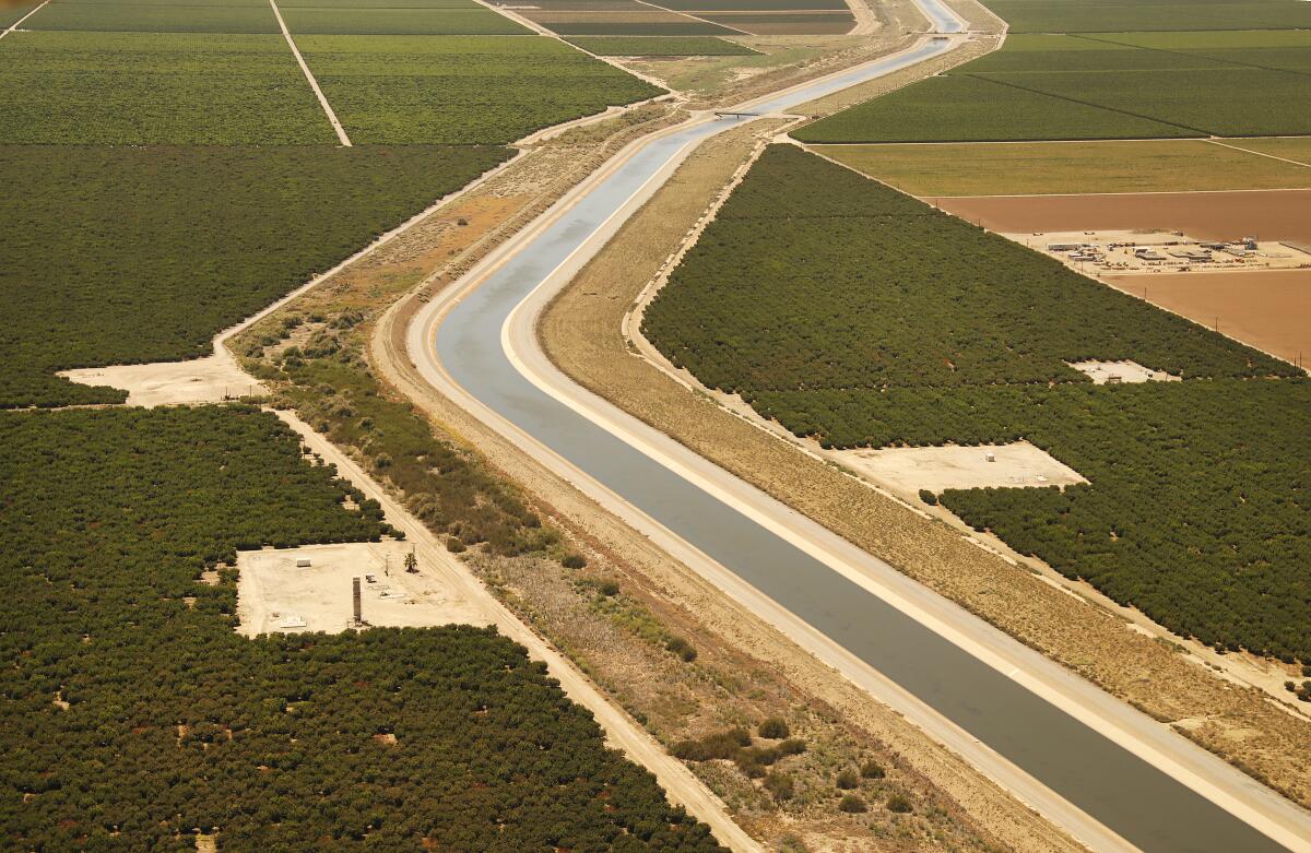 The California Aqueduct carries water from the San Francisco Bay Delta through farmlands in the San Joaquin Valley.