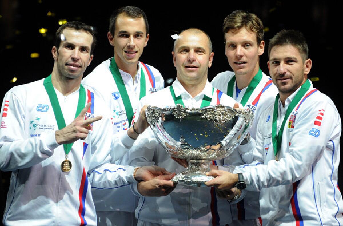 Czech Rebublic team members -- from left, Radek Stepanek, Lukas Rosol, captain Vladimir Safarik, Tomas Berdych and Jan Hajek -- hold the Davis Cup after defeating Serbia, 3-2.