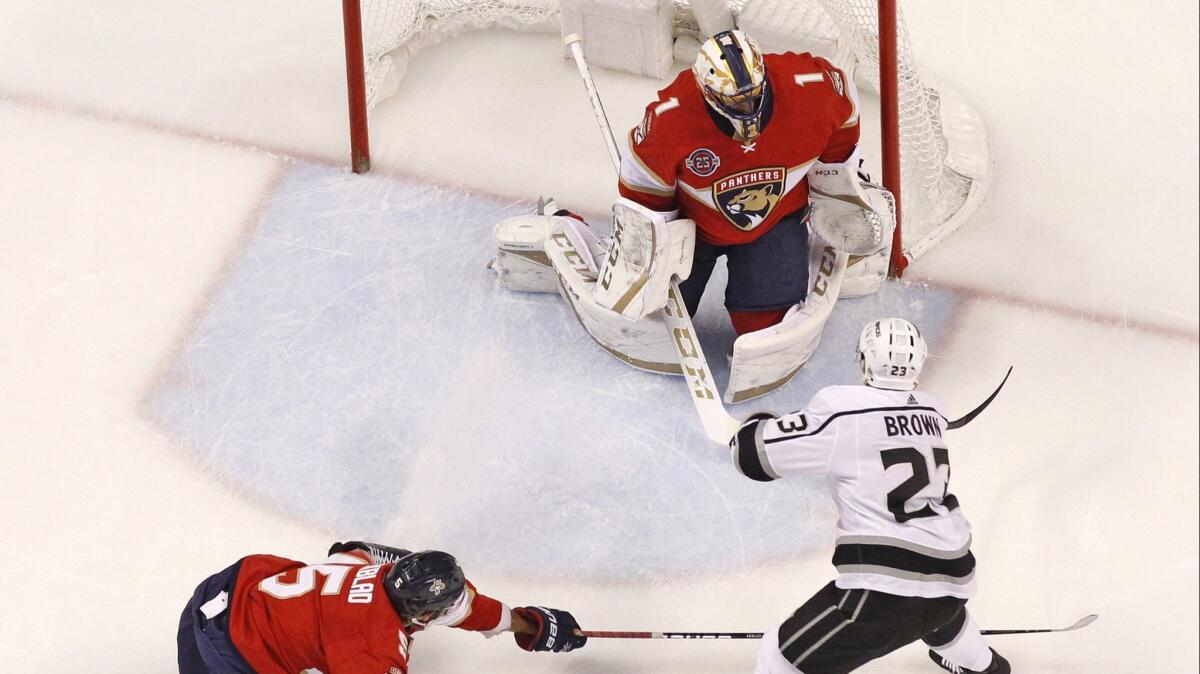 Kings forward Dustin Brown scores on Florida Panthers goaltender Roberto Luongo during the first period of the Kings' 6-1 loss Saturday.