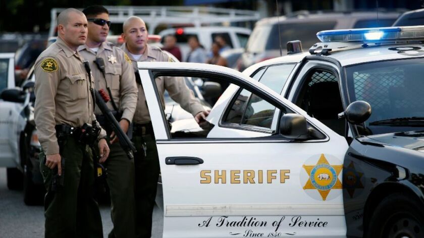 Los Angeles County Sheriff's deputies respond to a scene in Compton on December 7, 2016.