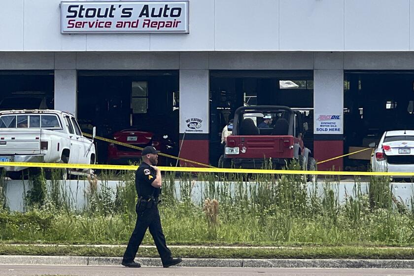 Law enforcement investigate the scene of a shooting, Sept. 27, 2023 in Largo, Fla. A shooting at the Florida auto shop that left two men dead was triggered by a former customer’s dissatisfaction with work done on his car two years ago. The Largo Police Department said Eugene Frank Becker, 78, arrived at Stout’s Automotive in a rental car and sought out business owner Jodie Stout, 52. Investigators say Becker pulled out a handgun and shot Stout, who then returned fire with his own gun, striking Becker multiple times. Both men later died at a hospital. (Douglas R. Clifford/Tampa Bay Times via AP, file)