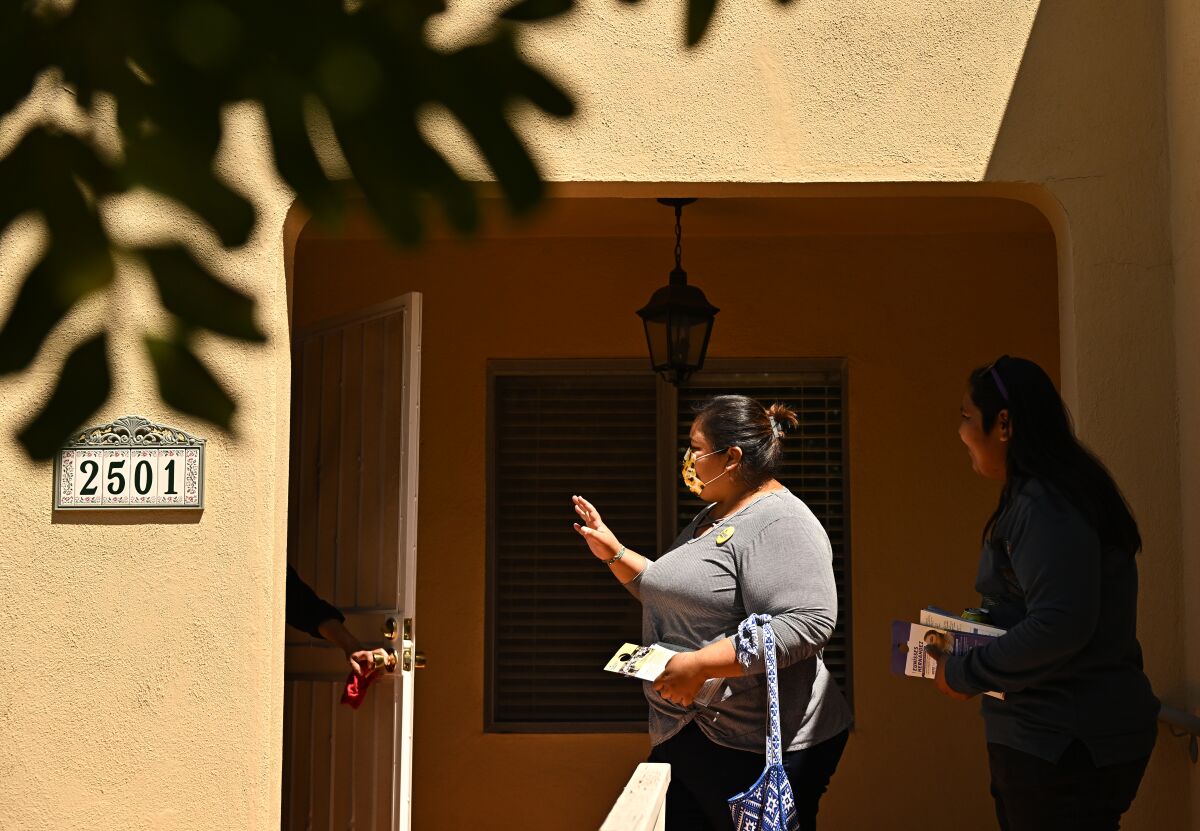 Community activist Eunisses Hernandez, who is running for L.A. City Council, talks with Glassell Park residents.