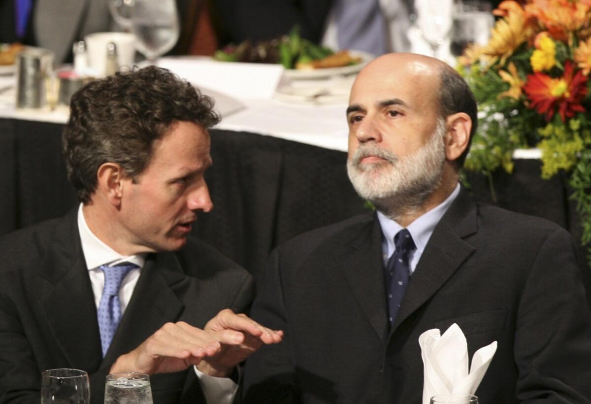 Then Federal Reserve Chairman Ben S. Bernanke, right, listens to Timothy F. Geithner, president of the New York Federal Reserve at the time, before speaking at the Economic Club of New York during the 2008 financial crisis.