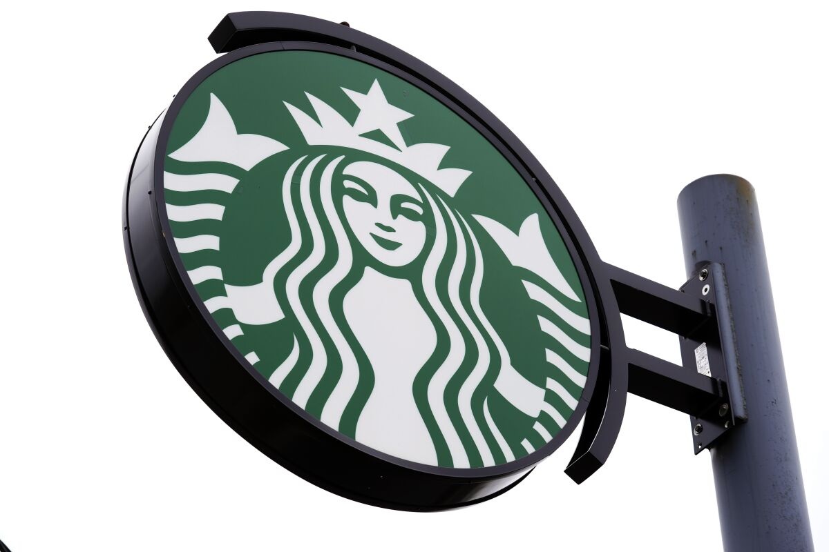 A sign with the Starbucks logo