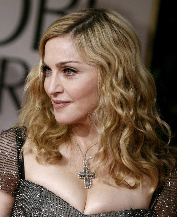 Madonna pays homage to herself in a platinum, pearl and diamond Neil Lane cross necklace.