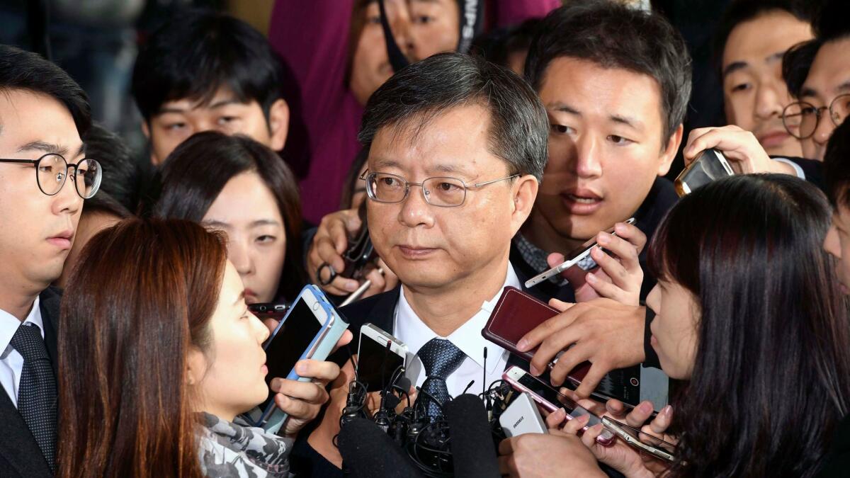 Woo Byung-woo, former senior presidential secretary for civil affairs, appears at the Seoul Central District prosecutors' office.