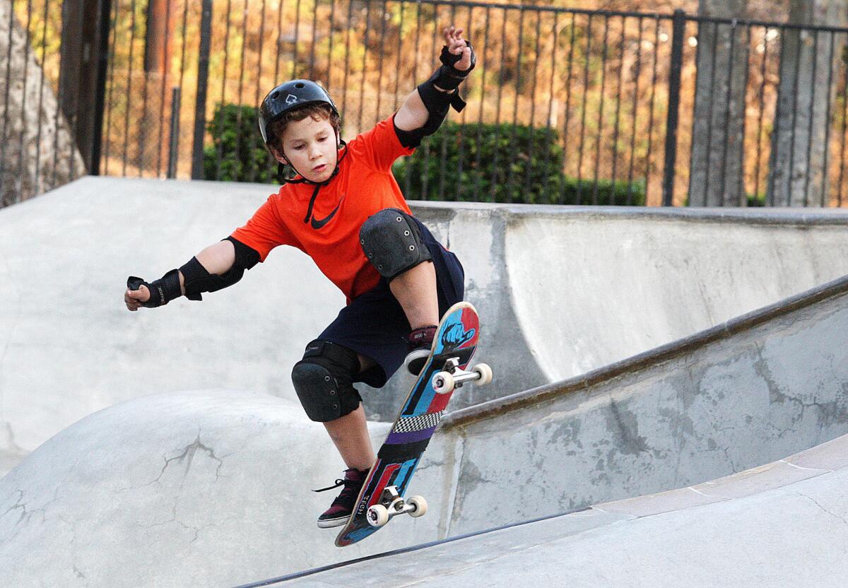 Nathaniel Frink, 11, of La Crescenta, catches air on his board at the Verdugo Skate Park in Glendale on Wednesday, Oct. 23, 2013. The park attendance has dropped in the past year after fees increased 50 percent last October.