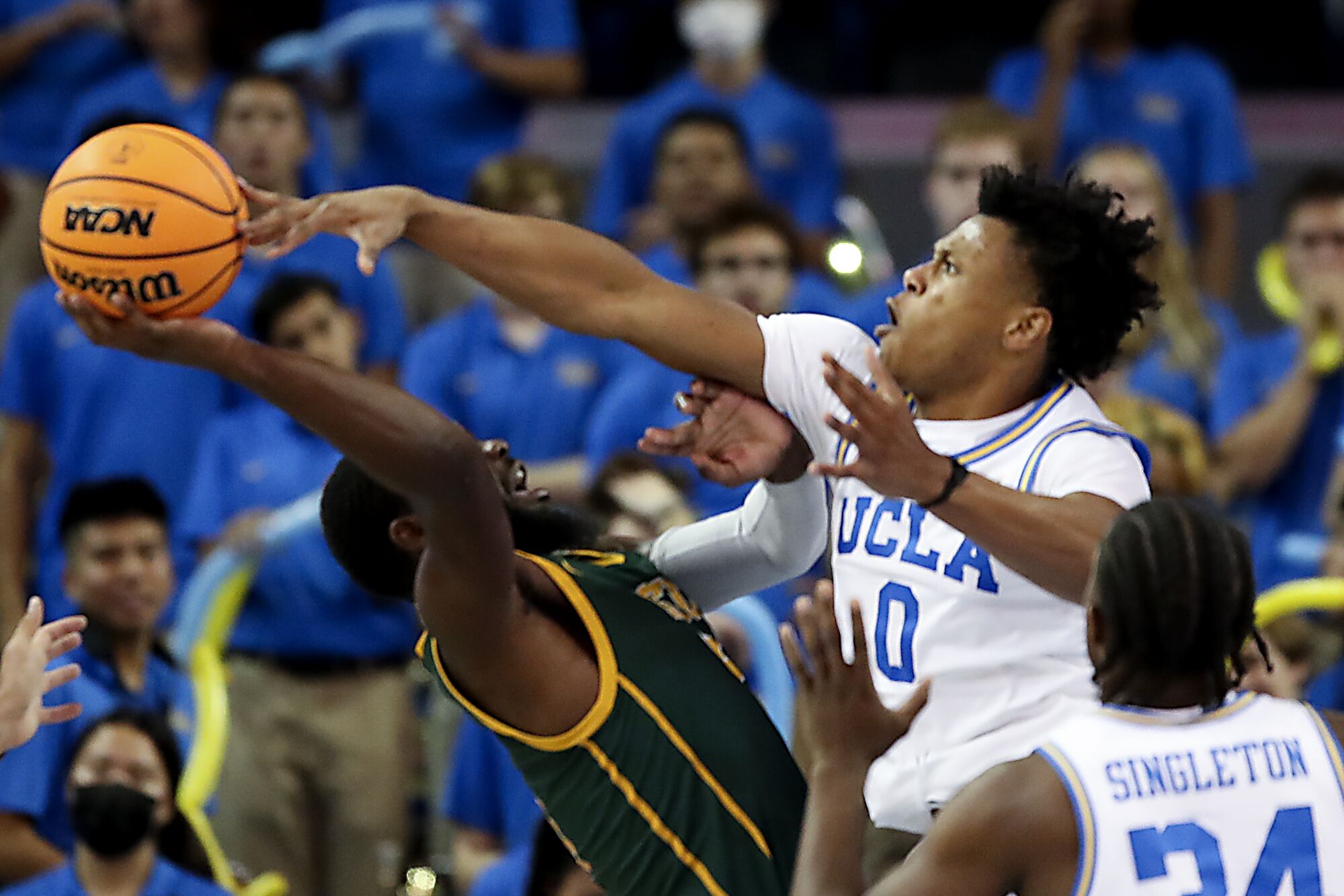 UCLA guard Jaylen Clark, #0, blocks a shot by Norfolk State guard Joe Bryant Jr.