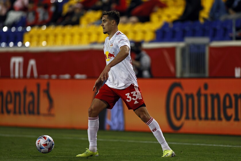 FILE - New York Red Bulls midfielder Aaron Long (33) looks to pass against Sporting Kansas City during an MLS soccer match April 17, 2021, in Harrison, N.J. A 29-year-old central defender, Long has made 29 appearances for the U.S. since 2018 and would be candidate to start if fully fit. He was Major League Soccer's defender of the year in 2018, when he was picked for the league's All-Star team. (AP Photo/Adam Hunger, File)