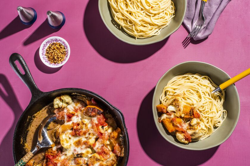 A photograph of Pizza brocc with a side of garlicky spaghetti by Dawn Perry for the Los Angeles Times Week of Meals.