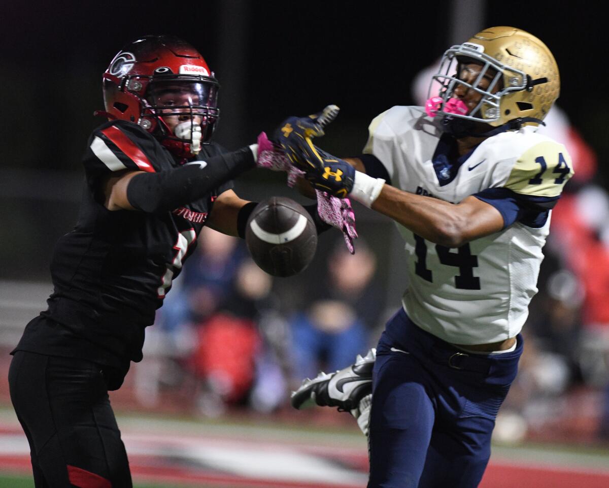 Corona Centennial cornerback Tayten Beyer (left) knocks down the ball on a pass intended for Vista Murrieta's AJ Jones.