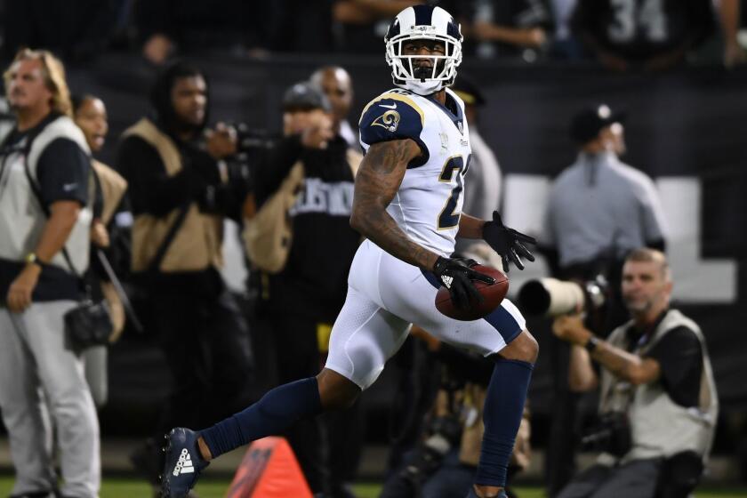 OAKLAND, CA - SEPTEMBER 10: Marcus Peters #22 of the Los Angeles Rams runs to the endzone after an interception of Derek Carr #4 of the Oakland Raiders in the fourth quarter of their NFL game at Oakland-Alameda County Coliseum on September 10, 2018 in Oakland, California. (Photo by Thearon W. Henderson/Getty Images) ** OUTS - ELSENT, FPG, CM - OUTS * NM, PH, VA if sourced by CT, LA or MoD **