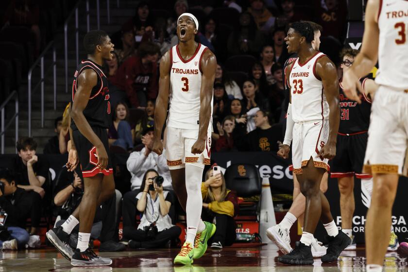  USC Trojans forward Vincent Iwuchukwu (3) yells out after making a basket at the Galen Center. 