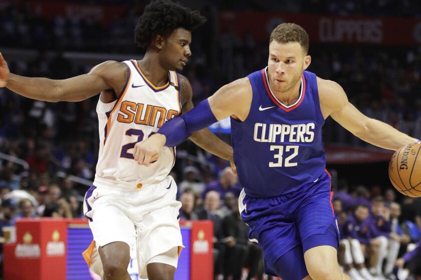 Los Angeles Clippers' Blake Griffin drives past Phoenix Suns' Josh Jackson during the second half of an NBA basketball game Sunday, Oct. 22, 2017, in Los Angeles. (AP Photo/Jae C. Hong)