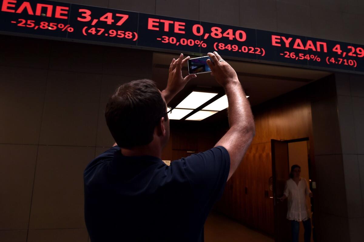 The stock index ticker in the lobby of the Athens Stock Exchange in Athens on Monday is photographed.