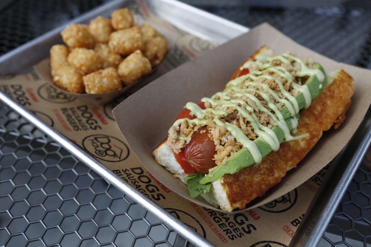 Dog Haus signed a deal enabling it to expand from 21 locations to nearly 500 in the next seven years. Above, its Sooo Cali hot dog, with wild arugula, basil aioli, avocado and tomato.