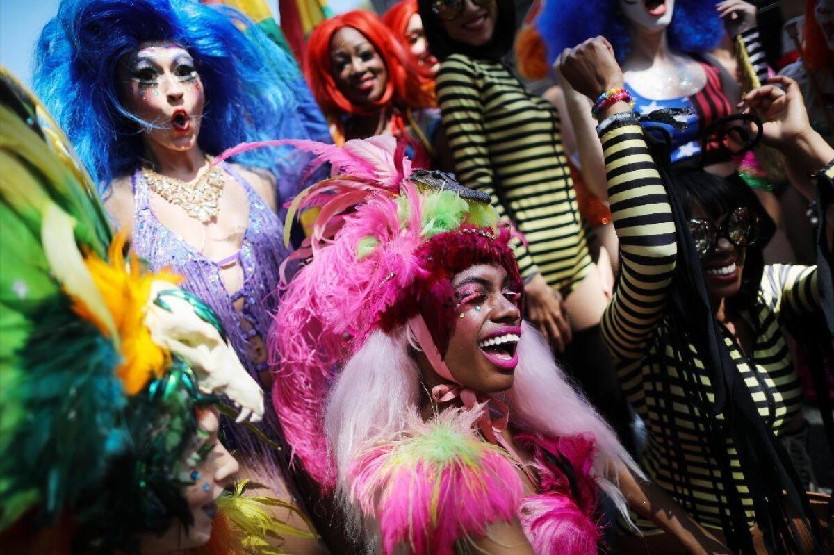 Revelers gather at the Los Angeles Pride parade Sunday in West Hollywood. The 49th annual parade, celebrating LGBTQ identity, drew thousands to the streets of West Hollywood.