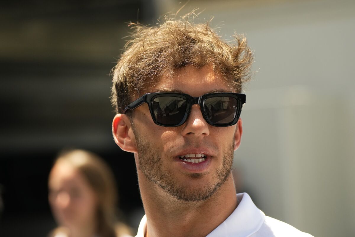 AlphaTauri driver Pierre Gasly of France arrives prior to the third free practice at the Baku circuit, in Baku, Azerbaijan, Saturday, June 11, 2022. The Formula One Grand Prix will be held on Sunday. (AP Photo/Sergei Grits)