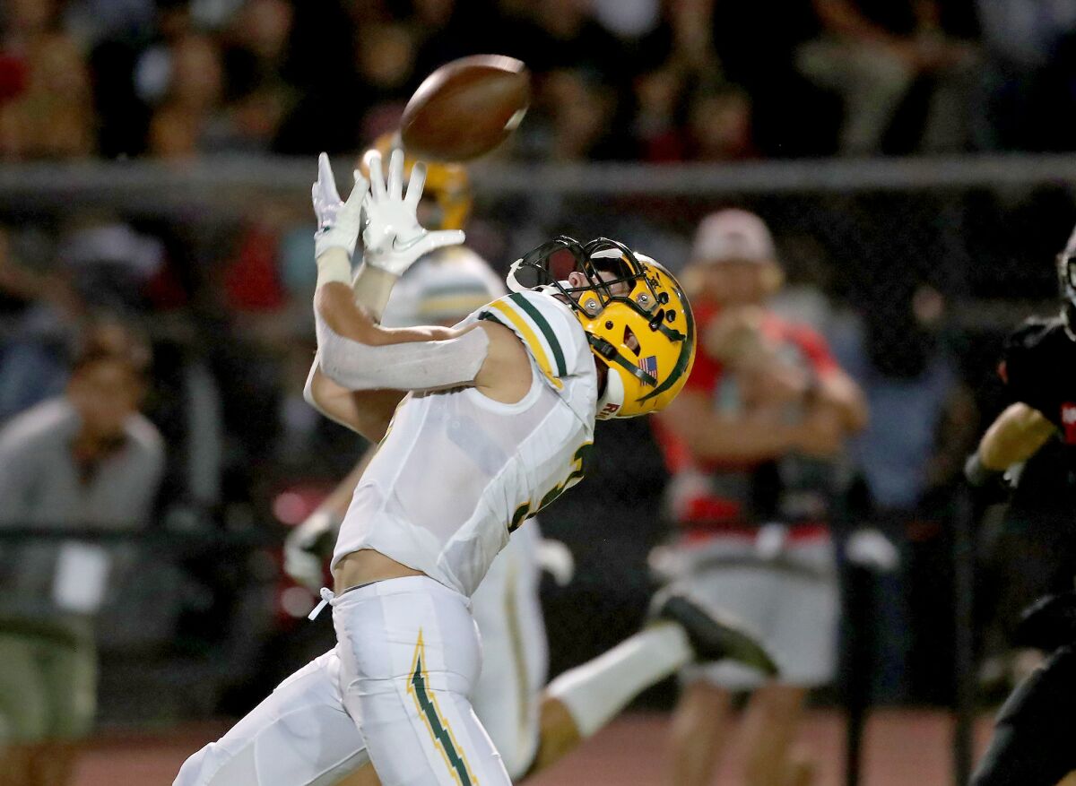 Edison receiver Ashton Hurley makes an over-the-shoulder catch on the run for a touchdown at San Clemente on