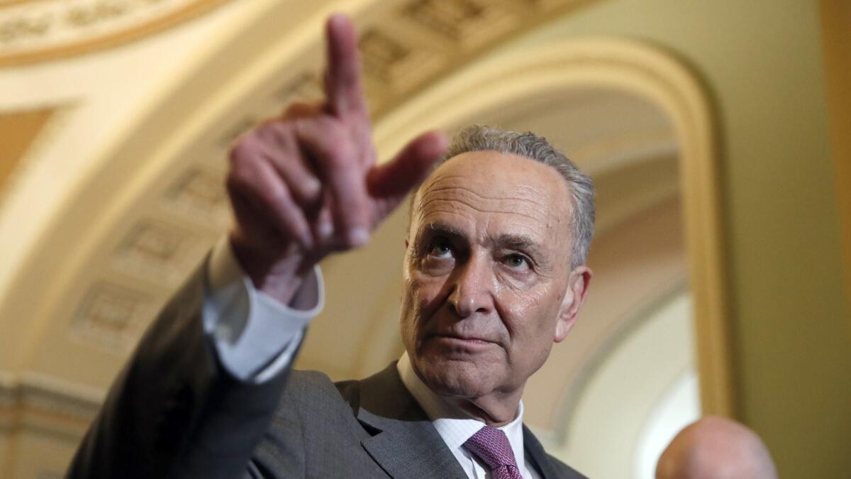 Senate Minority Leader Charles E. Schumer (D-N.Y.) points to a questioner during a media availability on Capitol Hill on Tuesday.