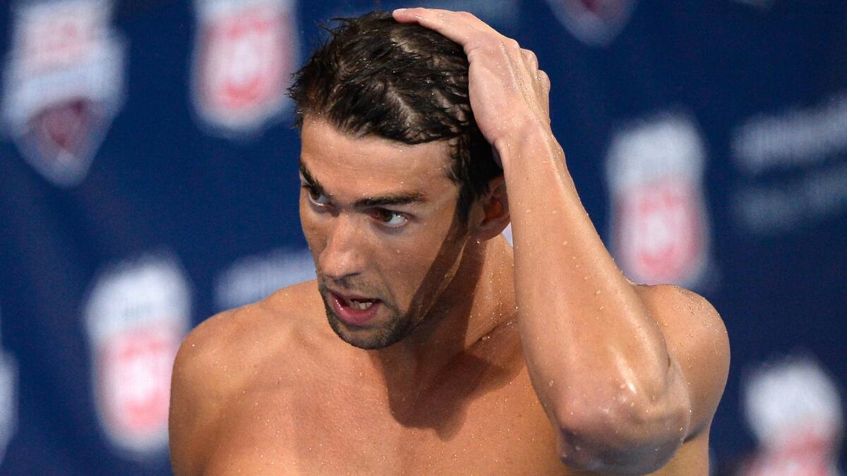 Olympic gold medalist Michael Phelps was suspended by USA Swimming on Monday after his arrest last week on DUI charges. Above, Phelps after a race in Irvine in August.