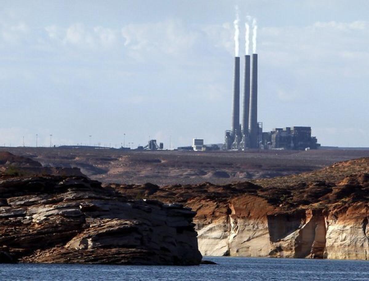 Coal-fired power plants, such as the Navajo Generating Station in Arizona, contribute to the record levels of carbon dioxide in the Earth's atmosphere. The atmospheric carbon dioxide level is expected to soon hit a troublesome milestone of 400 parts per million, scientists say.