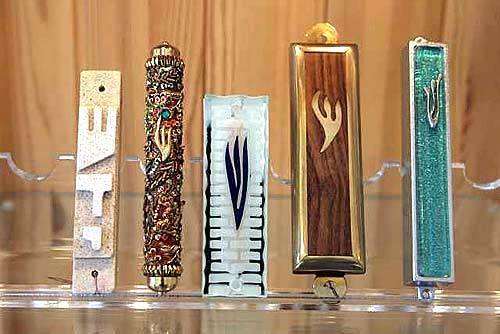 All from Israel Mezuzas, from left, of modernist sandstone, $30; with fine crystals and beads, $99; and of contemporary glass, $35; from Mezuzah Gallery 1440 1/2 S. Robertson Blvd., (310) 278-4428.
