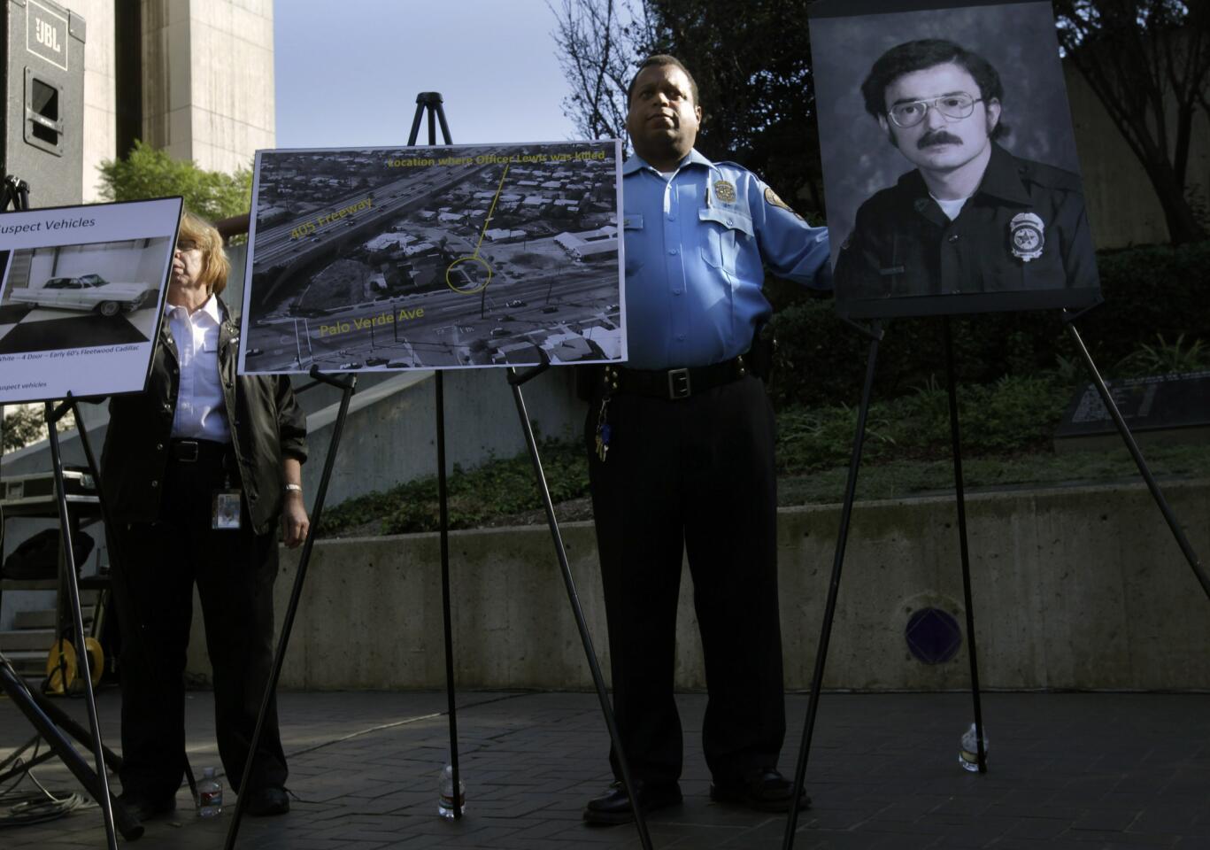 Long Beach Police Officer Michael Brown holds easels showing evidence and a photo of Officer Franke Neal Lewis, whose 1975 slaying remains unsolved. The department announced a reward for information of at least $50,000 for information leading to the arrest and conviction of his killer.