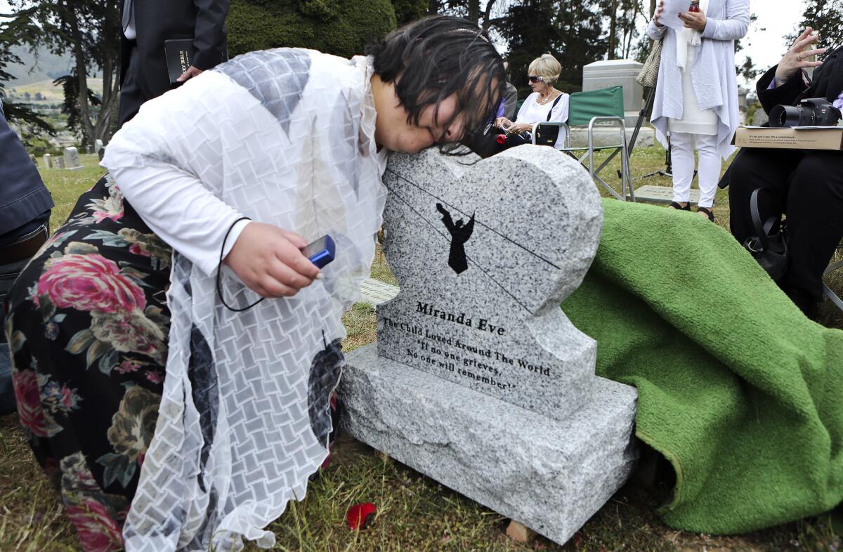 More than 100 people attended a ceremony for the girl's reburial in Colma, less than 10 miles from where she was originally buried. They christened her 'Miranda Eve.' (Mel Melcon / Los Angeles Times)