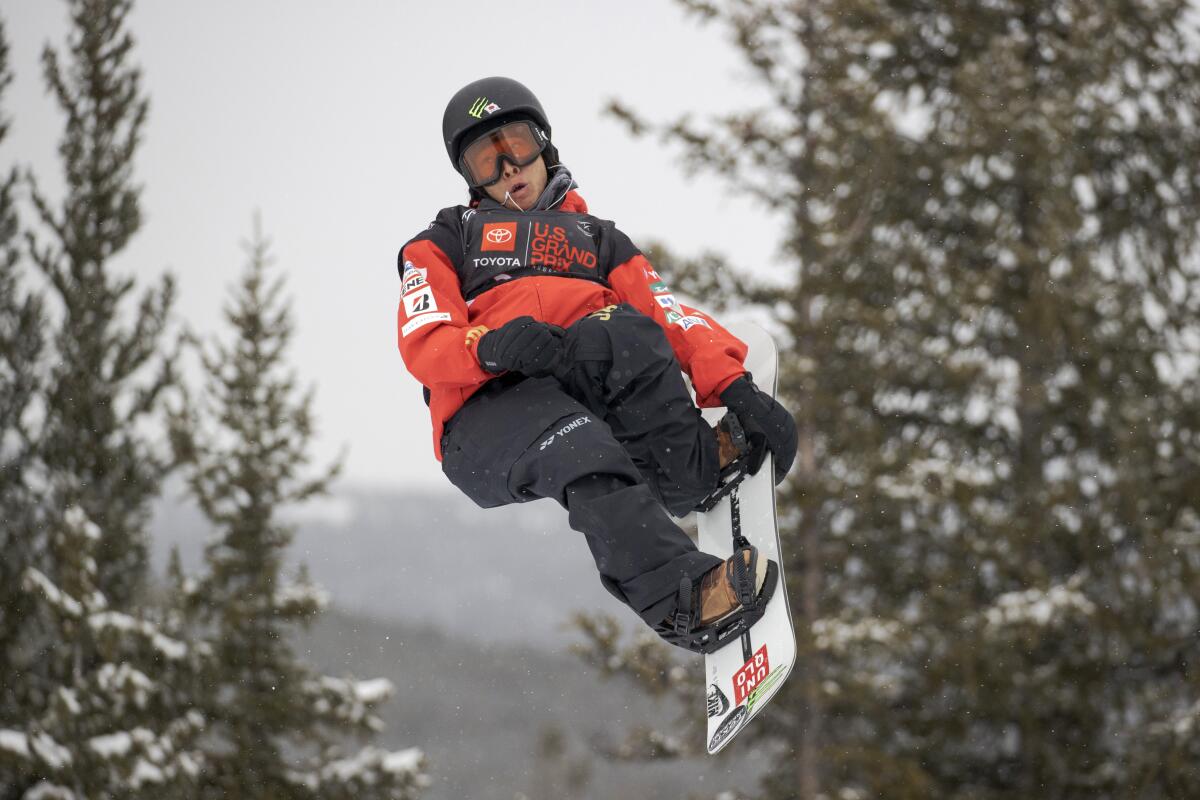 FILE - Ayumu Hirano, of Japan, makes a qualifying run on the halfpipe Thursday, Dec. 9, 2021, during a U.S. Grand Prix snowboarding event at Copper Mountain, Colo. Long filled with potential, but only Ayumu Hirano's two silver medals to show for it over the past decade, a crew of Japanese riders appears poised to take over the halfpipe in Beijing with four bona fide gold-medal contender. (AP Photo/Hugh Carey, File)