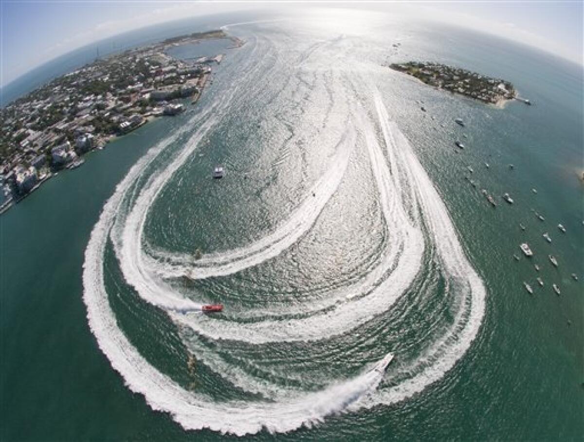 In this photo, provided by the Florida Keys News Bureau, offshore powerboats make the turn in Key West Harbor Wednesday, Nov. 9, 2011, during the first of three race days at the Key West World Championship in Key West, Fla. The event has attracted about 60 high-speed racing boats, from the U.S.. and six foreign countries, competing in the season-ending finale for the 2011 Superboat International season. (AP Photo/Florida Keys News Bureau, Andy Newman)