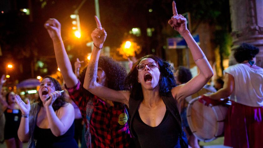 Thousands of Brazilians protest against a bill that aims to cut the right to abortion in Rio de Janeiro.